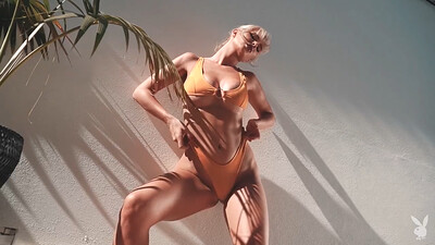 Big breasted hottie playfully displaying her stunning body in a bikini